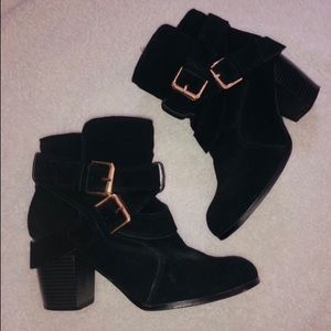 Heeled black booties